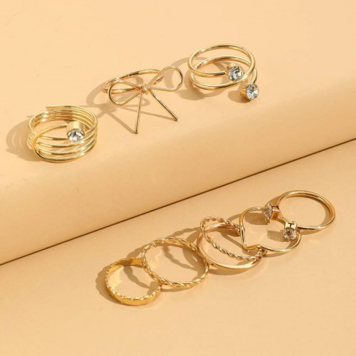Dámska móda, doplnky - Súprava prstienkov 8 kusov - zlatá - Golden bow